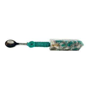 Green crystal spoon with metal handle.