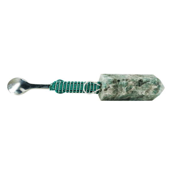 Green crystal spoon with metal handle.