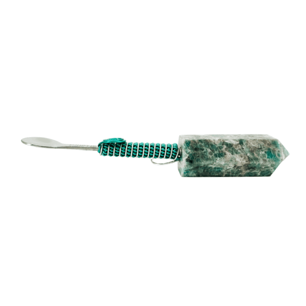 Green crystal spoon with silver handle.