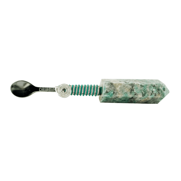 Emerald crystal spoon with silver handle.