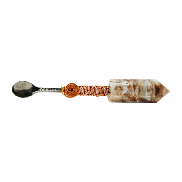 Silver spoon with stone handle and copper wire.