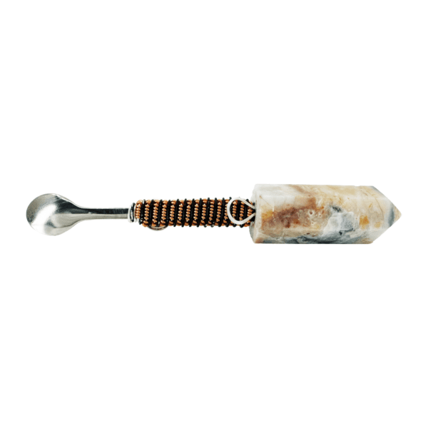 Stone spoon with copper and black wrap.