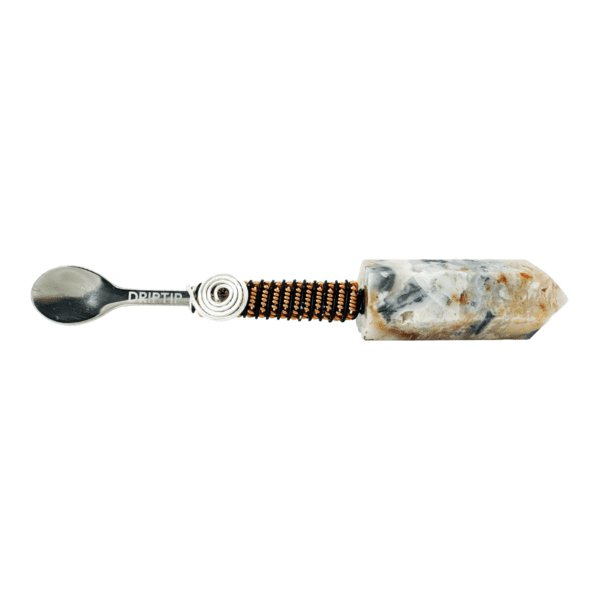 Silver spoon with crystal handle and wrap.