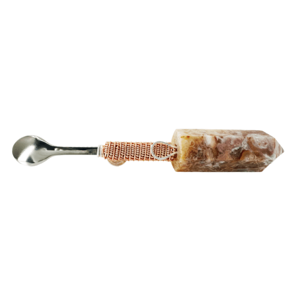 Stone spoon with copper wire handle.