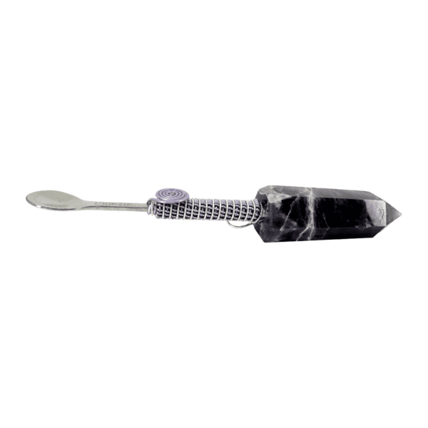 Black crystal spoon with silver handle.