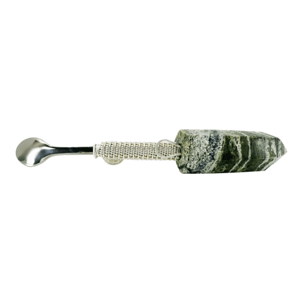 Green stone spoon with silver handle.