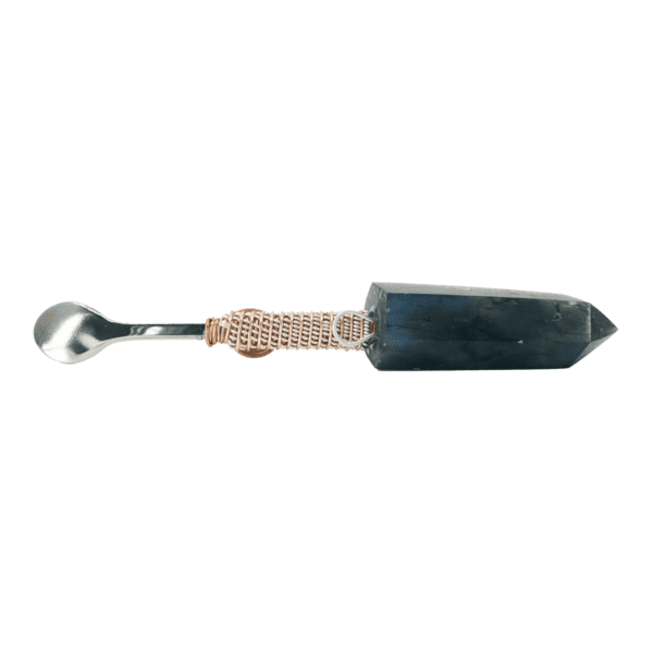 Silver spoon with black crystal handle.