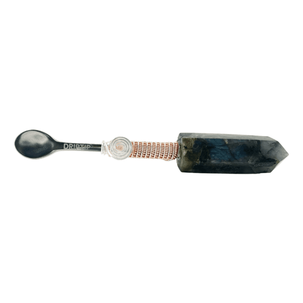 Black spoon with crystal handle and copper wire.