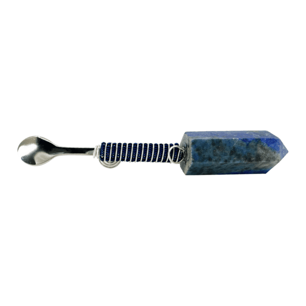 A spoon with a blue stone handle.