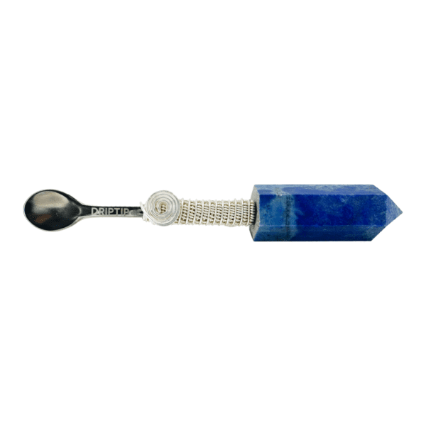 A spoon with a blue stone on it