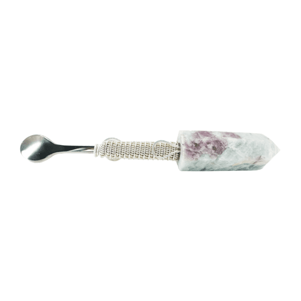 A spoon with a floral design on it.