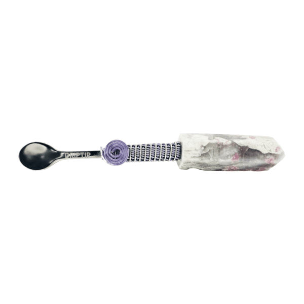 A spoon wrapped in plastic and purple thread.