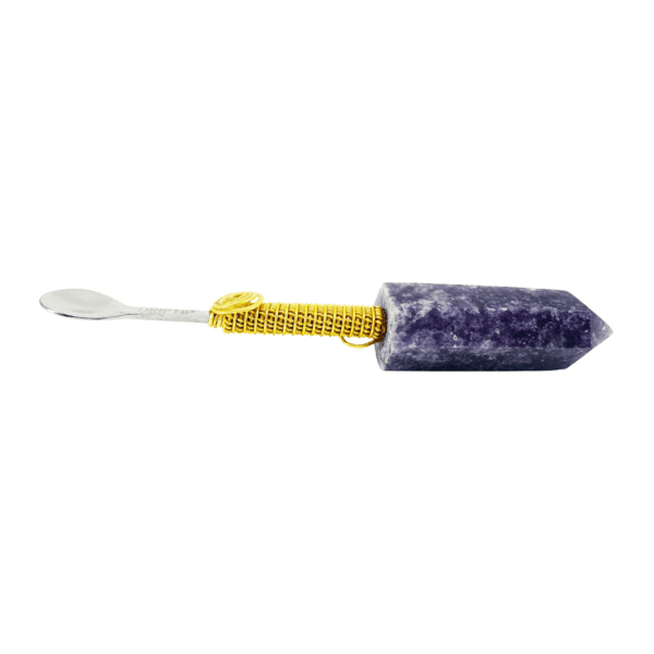 A purple and yellow toothbrush with a white handle.