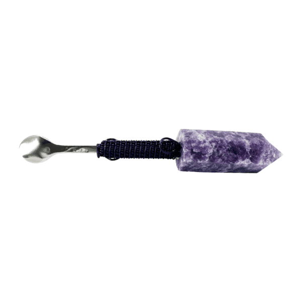 A purple stone with a wrench on it.