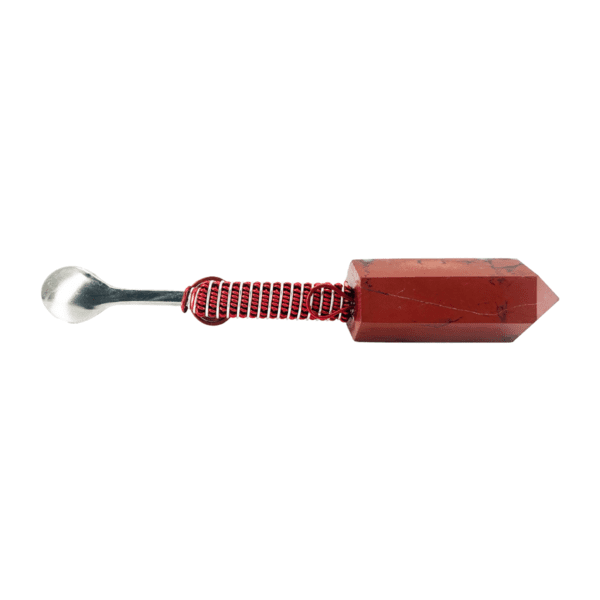 A red object with a white handle and a black tip.