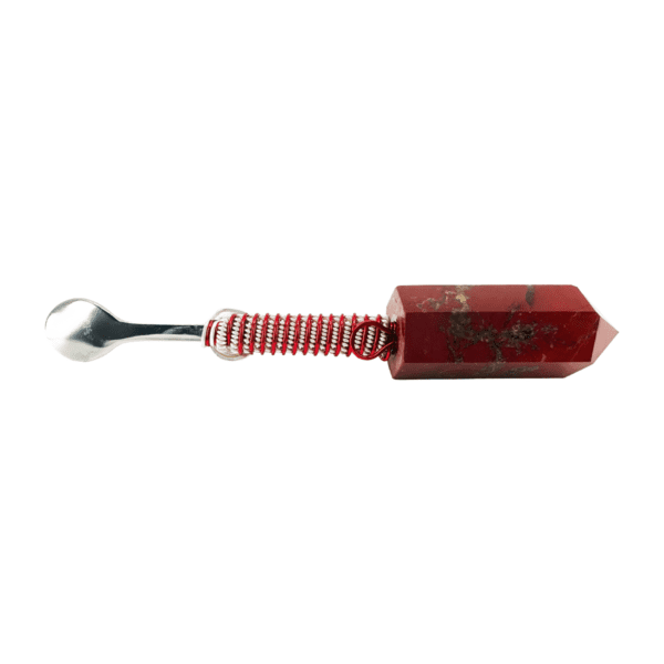 A red and white spoon with a red handle.