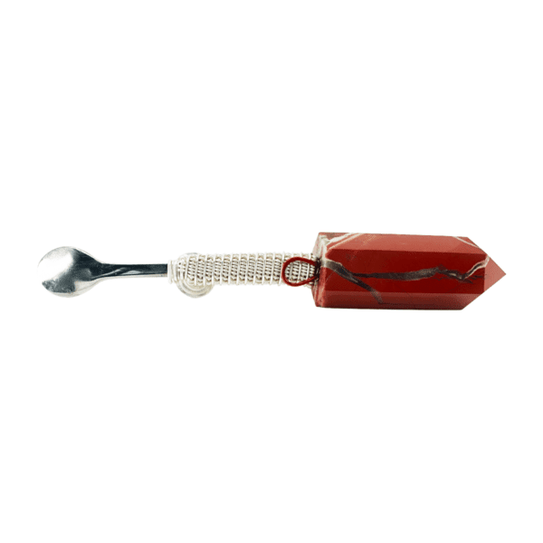 A red and white spoon with a handle