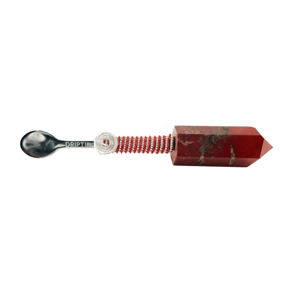 A spoon with a red handle and a white background