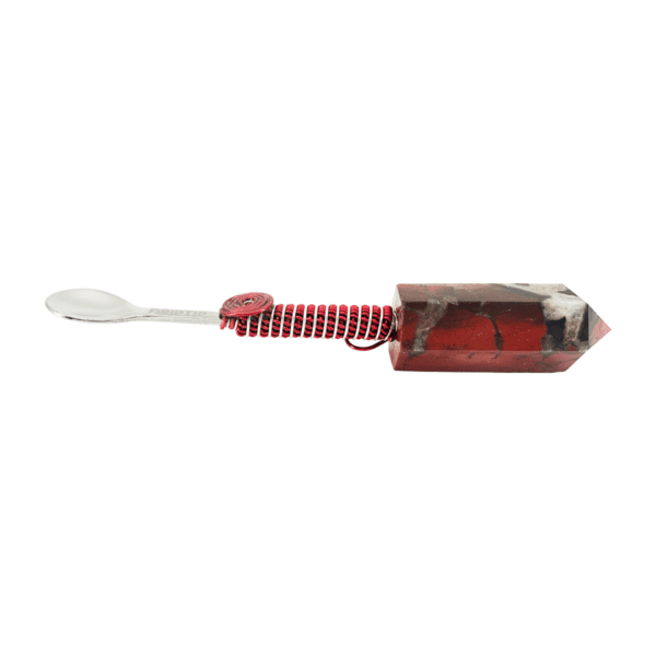 A red toothbrush with a white handle and a black stripe.