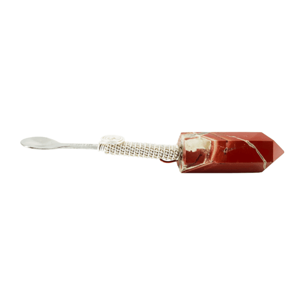 A red and white toothbrush with a tooth brush in it