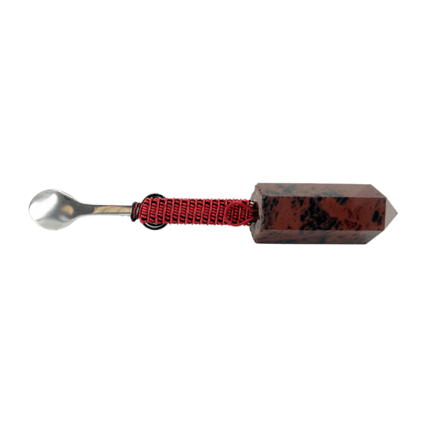 A red and black key with a metal handle.