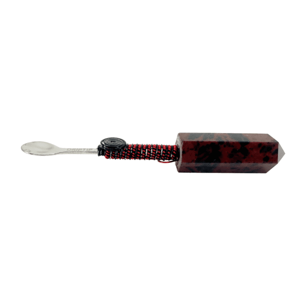 A red and black toothbrush with a white tooth brush.