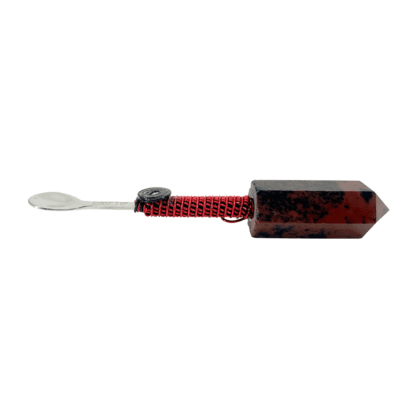 A red and black toothbrush with a white handle.