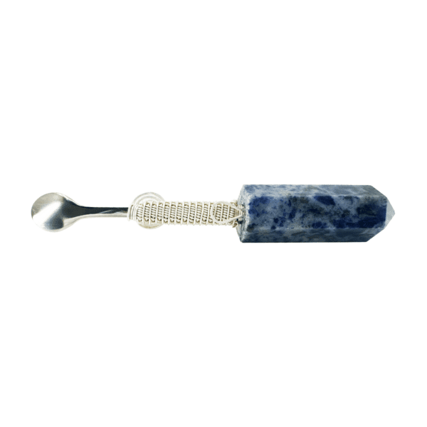 Blue crystal and silver spoon utensil.