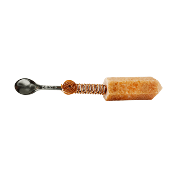 Crystal-handled spoon with copper wire.