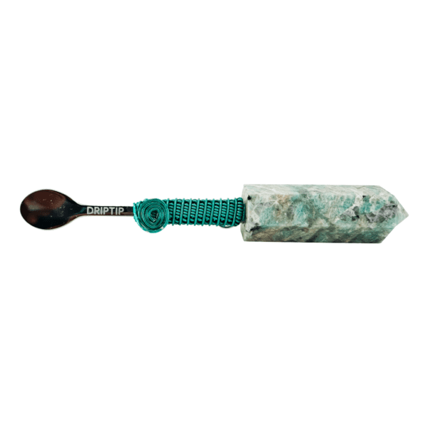 Green stone spoon with metal wrap.