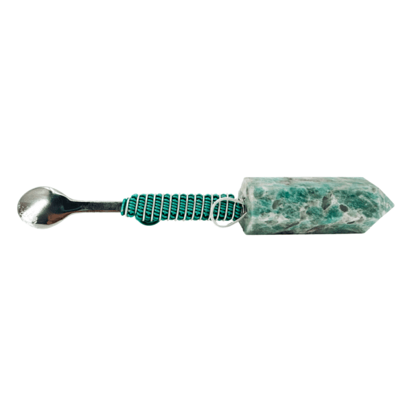 Green crystal with metal spoon handle.