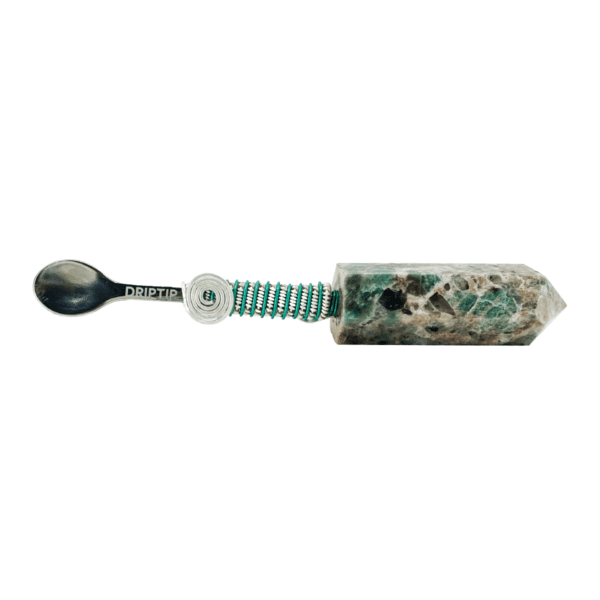 Silver spoon with green stone handle.