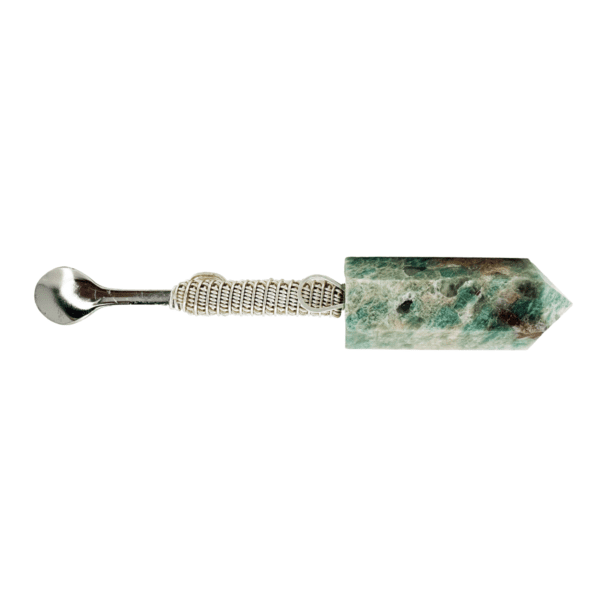 Green crystal spoon with silver handle.