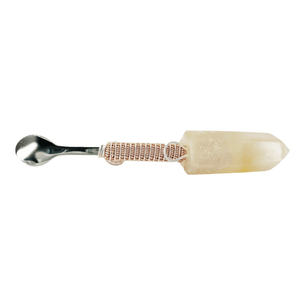 Crystal-topped metal spoon with wire wrap.