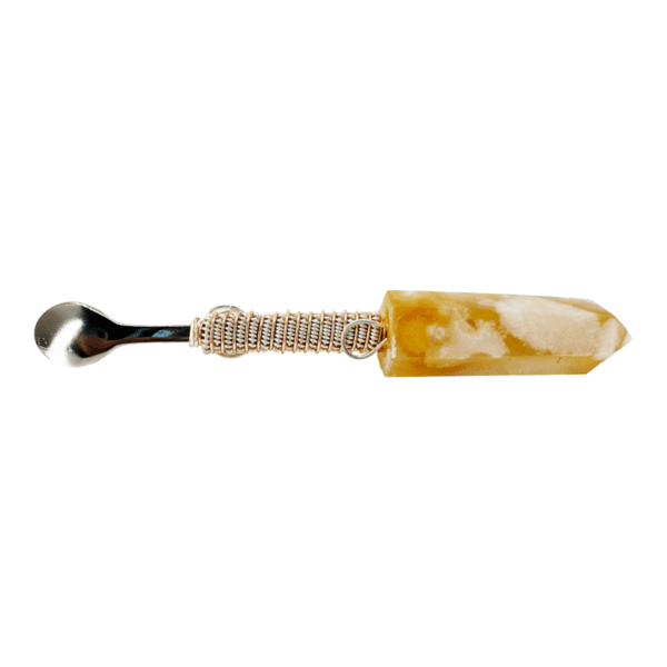 A golden crystal wrapped spoon.