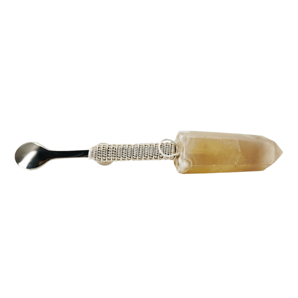 Crystal-handled spoon with silver wire wrap.