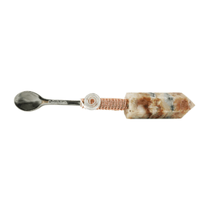 Silver spoon with crystal handle and copper wire.