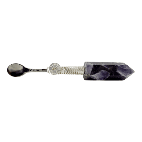 Amethyst crystal spoon with silver handle.