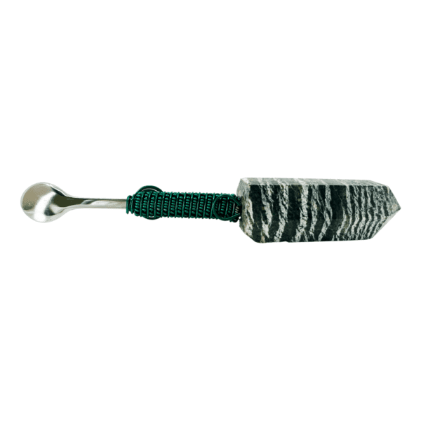 Black and white stone spoon with green wire.