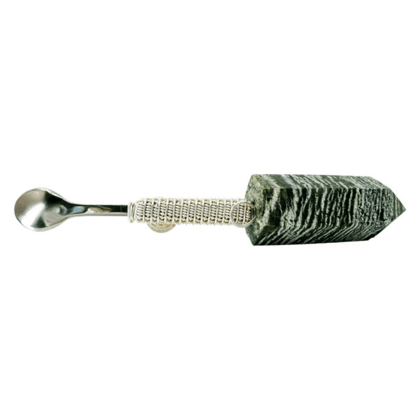 Green stone spoon with silver handle.