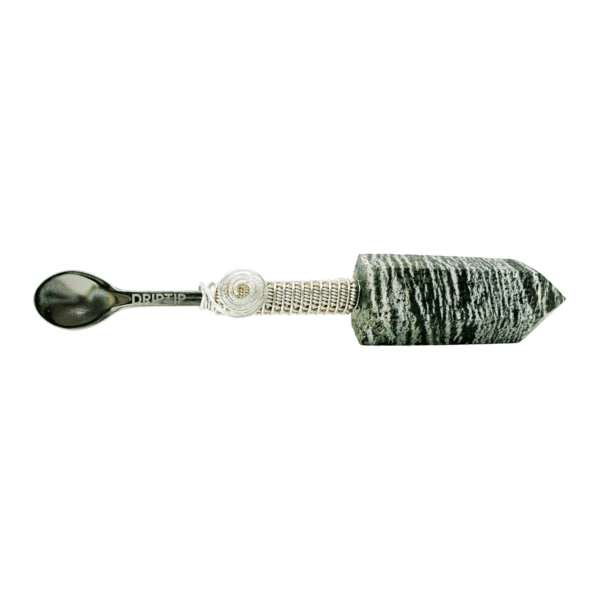 Silver spoon with a green stone handle.