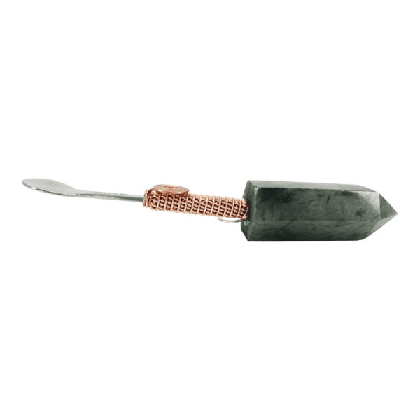 Copper-wrapped spoon with green crystal handle.