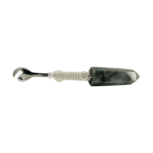 Silver spoon with black crystal point.