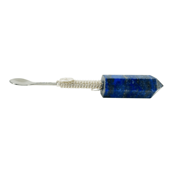 A blue stone is sitting on top of a white stick.