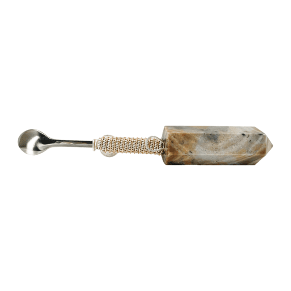 A large stone spoon with a metal handle.