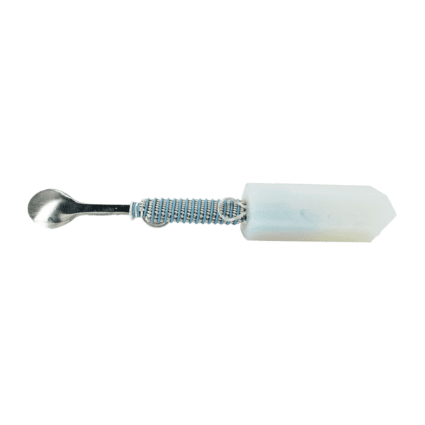 A white and black spoon with a handle