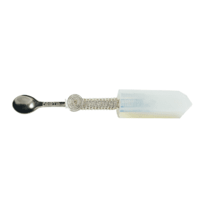 A spoon with a crystal handle on it.