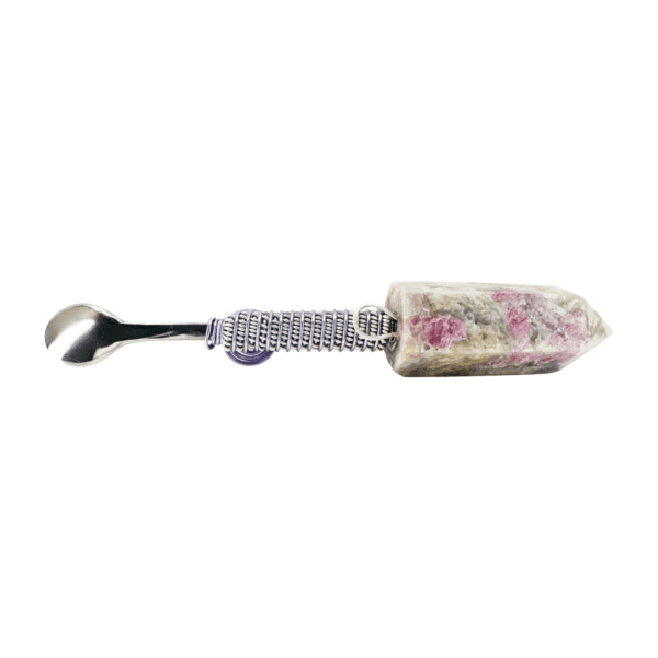 A spoon with a floral design on it.