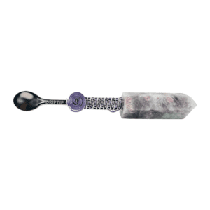 A spoon with a purple handle and a black tip.