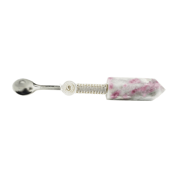 A spoon with a pink and white marble handle.